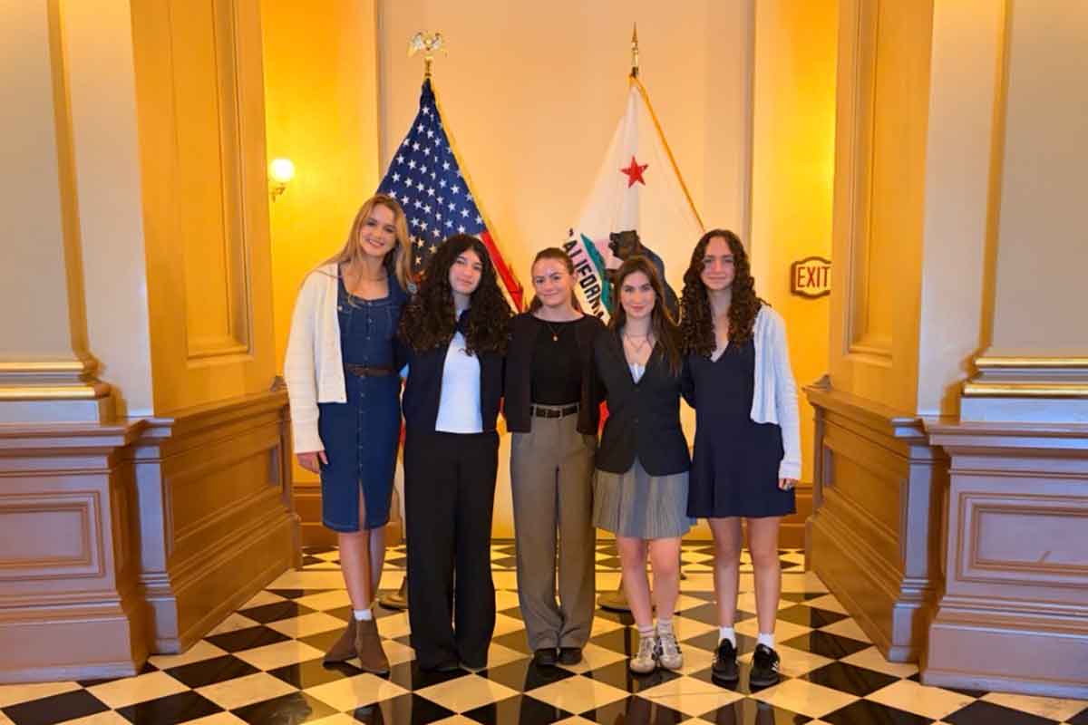 Sara Zacky (center) in Sacramento with a group of teens on an annual advocacy trip in partnership with the JCJ (Jewish Center for Justice).